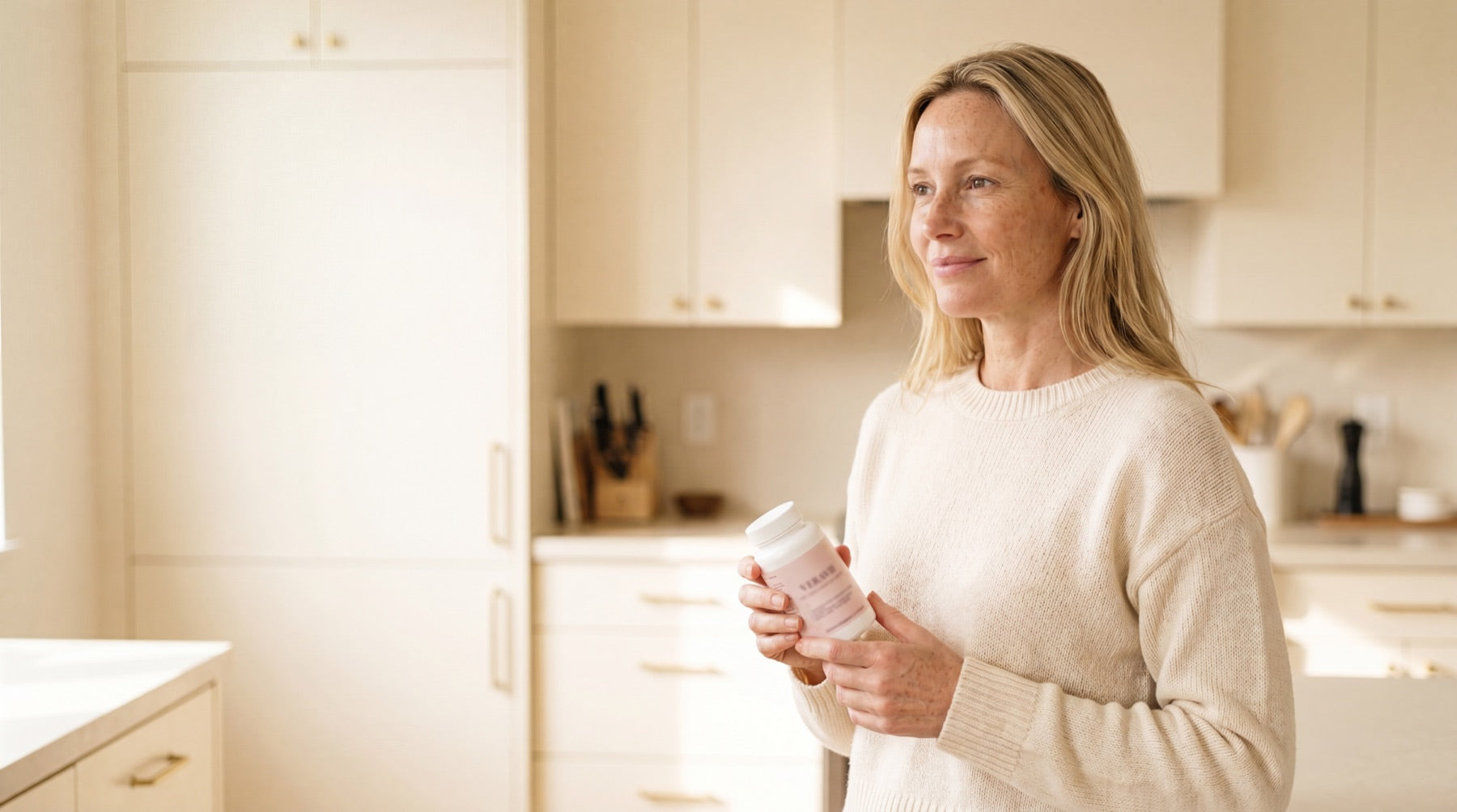 Woman in her 50s by a window